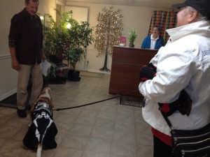 Chaps is adored by Dr. Leick's wife (in the background) she kisses him the entire time as she gently holds him.